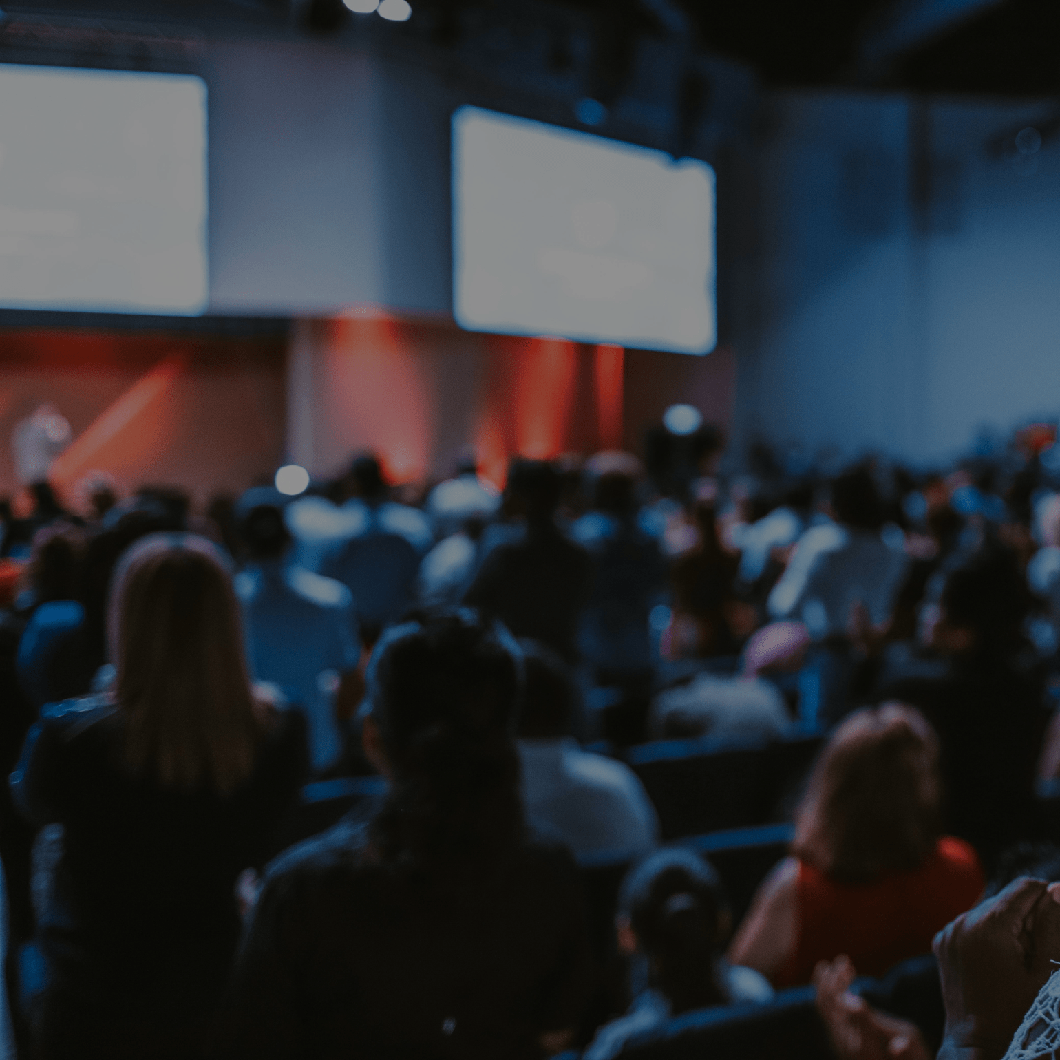 event-conference-room-filled-with-attendees-and-screens